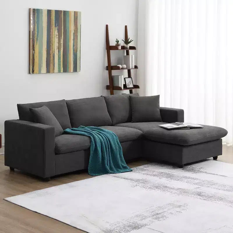 GDFStudio Bruce 101 Canapé sectionnel en forme de L en tissu avec pouf