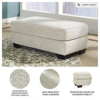 Pouf ottoman Monaghan Signature Design by Ashley, repose-pieds de salon rembourré en chenille couleur grès