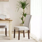 Chaises de salle à manger modernes sans accoudoirs avec tissu rembourré, garniture cloutée et pieds en bois