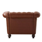 Fauteuil club Chesterfield Zeus et Ruta avec accoudoirs volutes, garniture cloutée et pieds en bois massif