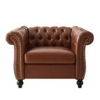 Fauteuil club Chesterfield Zeus et Ruta avec accoudoirs volutes, garniture cloutée et pieds en bois massif