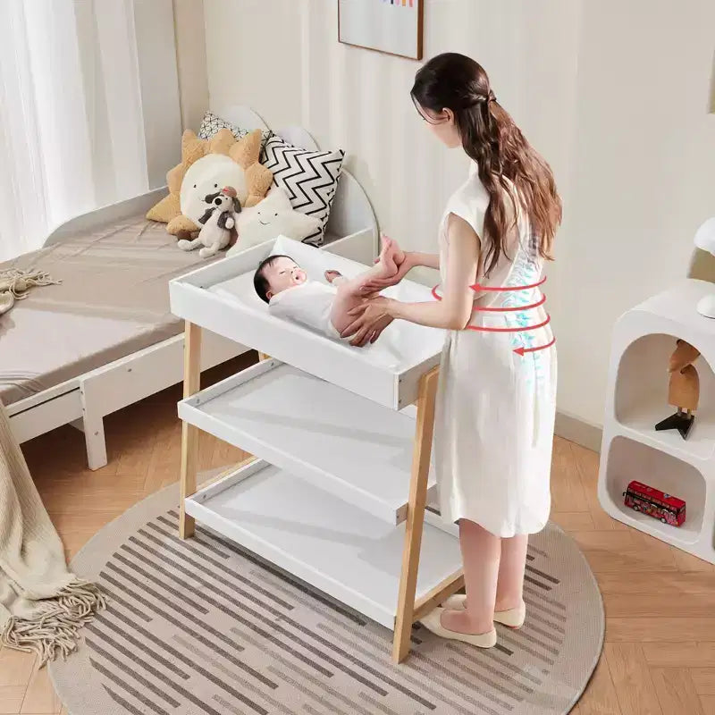 Table à langer portable moderne compacte avec matelas imperméable et 2 étagères de rangement pour nouveau-nés et nourrissons.