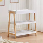Table à langer portable moderne compacte avec matelas imperméable et 2 étagères de rangement pour nouveau-nés et nourrissons.